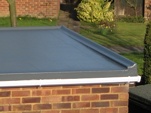 Domestic flat roofs are normally covered with felt and have been for many years, some also have stone chippings or gravel in addition to help shield the felt from the sun, many people complain that it fills the gutter and gives moss a good place to grow and looks un-slightly. 